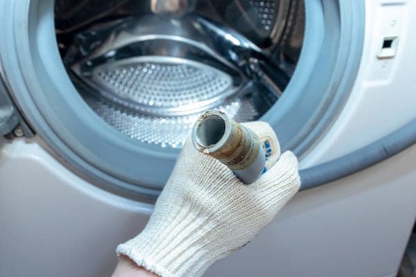 how to drain water from washing machine